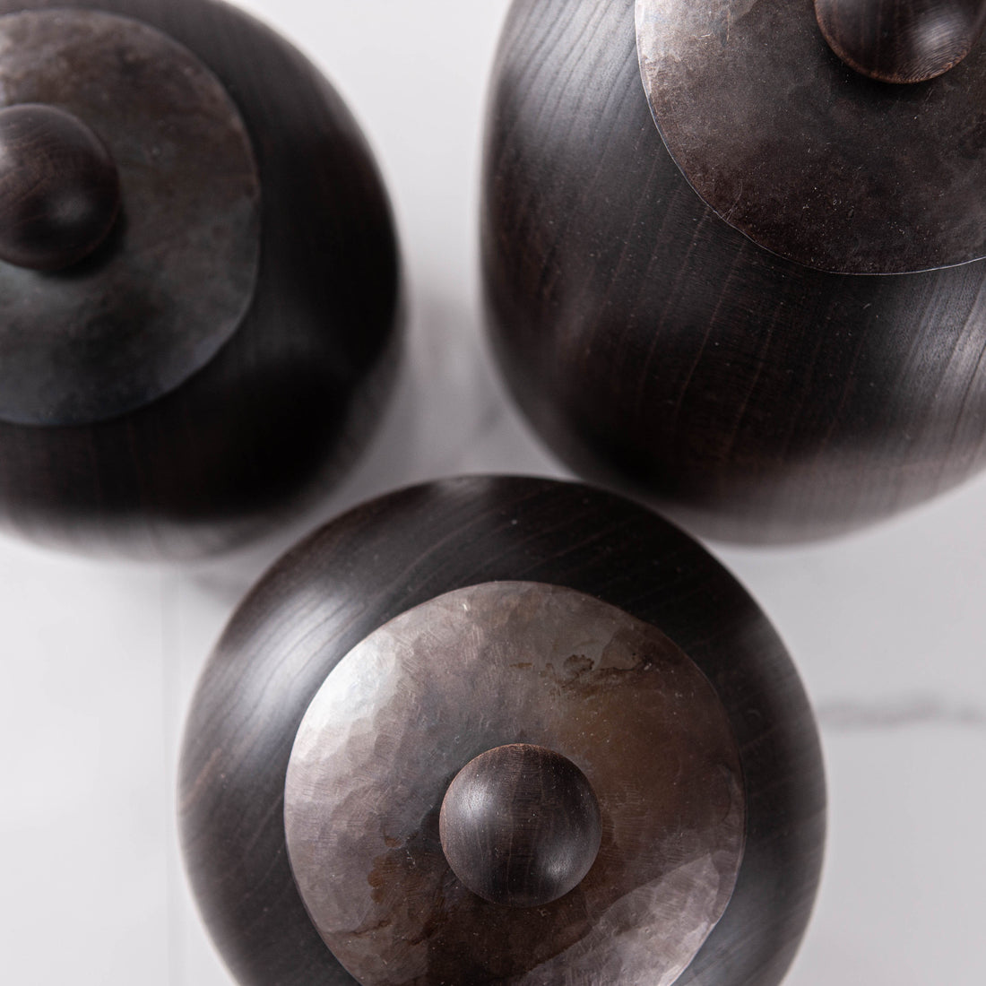 SET OF THREE LIDDED VESSELS IN EBONIZED CHERRY AND WAXED STEEL