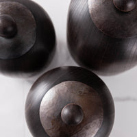 SET OF THREE LIDDED VESSELS IN EBONIZED CHERRY AND WAXED STEEL