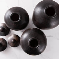 SET OF THREE LIDDED VESSELS IN EBONIZED CHERRY AND WAXED STEEL