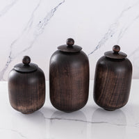 SET OF THREE LIDDED VESSELS IN EBONIZED CHERRY AND WAXED STEEL